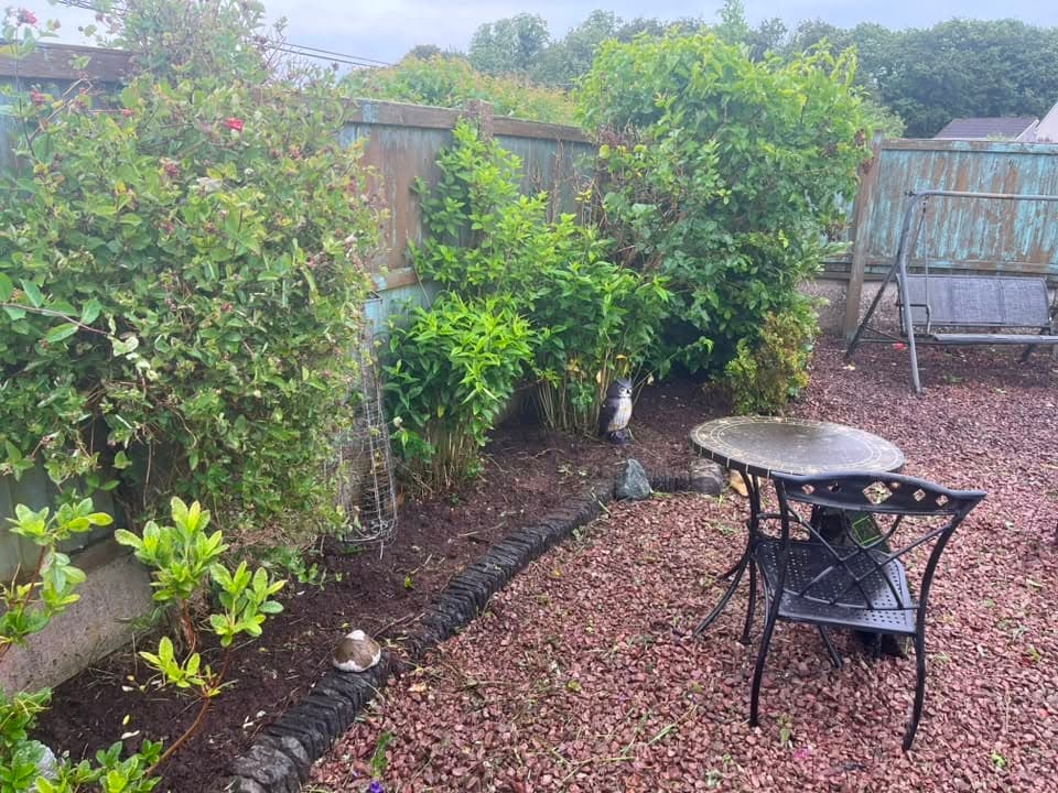 Tidied garden border and patio area after garden clearance completed by RML Ground Maintenance